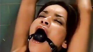 Girl gets raped by a bald man using a sex machine in a hardcore scene