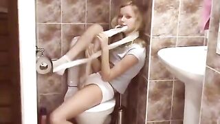 A blonde has a passionate surprise in the public toilet, showcasing her natural charm