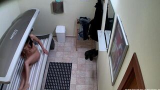 A hidden camera in a Czech solarium records a naked customer