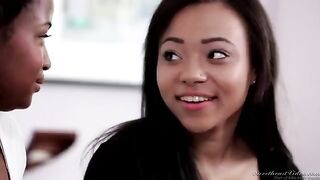 A black lesbian is having fun with her sister on the bed