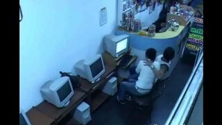 A guy almost fucks with a girl in a public internet cafe