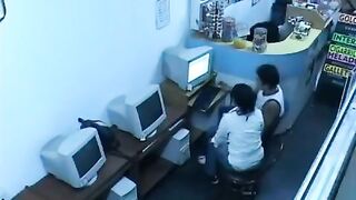 A guy almost fucks with a girl in a public internet cafe