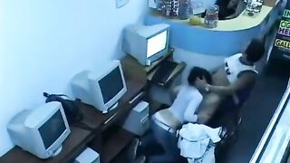 A guy almost fucks with a girl in a public internet cafe