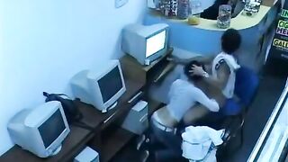 A guy almost fucks with a girl in a public internet cafe