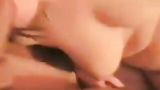 A girl with a big clitoris spreads her legs to show her naked cunt