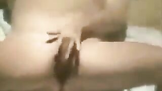 A girl masturbates on the beach, unaware of a hidden camera