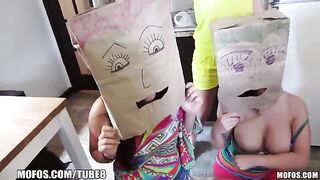The girls wore bags on their heads and fucked with a young guy