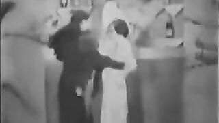 Porn from the past with a group of three people engaging in passionate acts