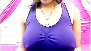 Her nipples are standing when her shirt is too small to hold them