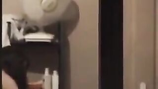 The guy admires himself in the mirror, completely naked, big dick