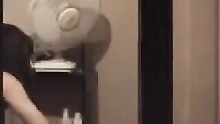 The guy admires himself in the mirror, completely naked, big dick