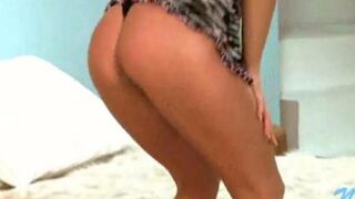 A young Russian debauchee removes her clothes to show her charms on camera