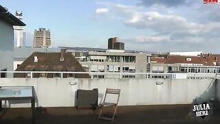 Hot brunette with big tits bounces on the roof in HD