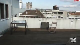 Hot brunette with big tits bounces on the roof in HD