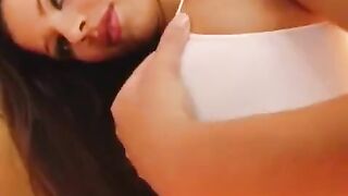The girl caresses her big, wet vagina with a dildo