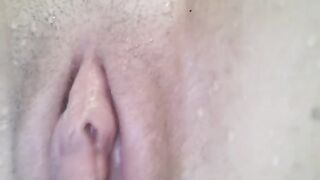 Babe has a powerful orgasm in the water and close-up pussy shot