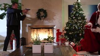 A woman received a gift from a fat Santa Claus for her stockings