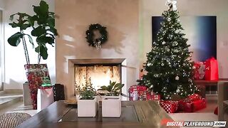 A woman received a gift from a fat Santa Claus for her stockings