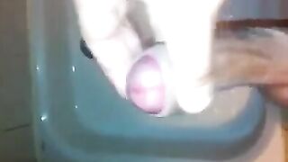 The kid caresses his dick in the shower, imitating sex with a girl