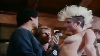 A group sex party with guys and girls in a retro setting
