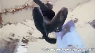 A hot naked girl is having fun in the pool