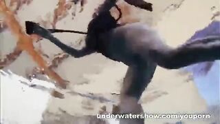 A hot naked girl is having fun in the pool
