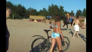 A girl has fun with her boobs on the beach