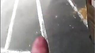 A guy masturbates his dick on the street and comes in his pants