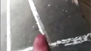 A guy masturbates his dick on the street and comes in his pants