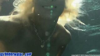 A hot girl is giving a blowjob to her boyfriend in the swimming pool