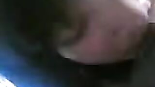 Careful Chinese girl sucks her boyfriend's dick by the bed
