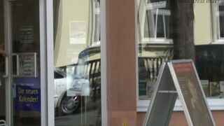 A girl walks on the street without panties, her ass is being filmed