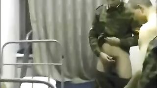 Cute girl is fucking with soldiers in the barracks