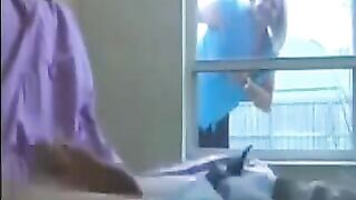 A woman peeps for a man sitting in the ward and jerking off a member