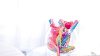 A girl has fun with a vibrator and latex clothes, embodying the raw allure of BDSM