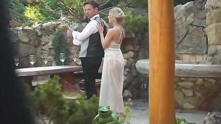 A pair of newlyweds are having their honeymoon on the street