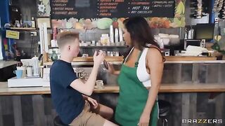 A girl with big boobs is working as a barista