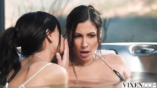 A man is having fun with two girls in a paradise setting