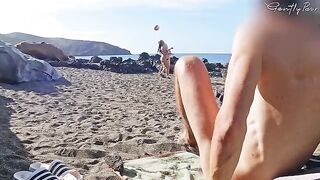 Two girls almost got caught jerking off on a nude beach in HD