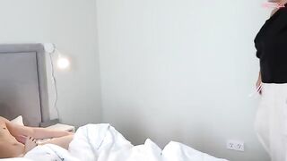 A cute girl bouncing on a big mom’s bed