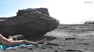 A girl removed her swimsuit and caressed herself on the naked beach