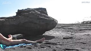 A girl removed her swimsuit and caressed herself on the naked beach