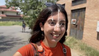 A girl is fucking on her eyes closed and mouth open