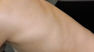 A cute 18-year-old girl was filming herself doing gymnastics in the kitchen