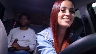 A hot chick is having fun in an unusual way in the car