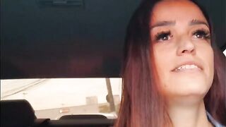 A hot chick is having fun in an unusual way in the car