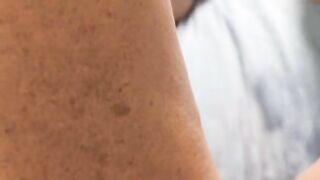 A woman caresses herself, her fingers gliding over her most sensitive spots