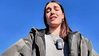 A petite brunette babe masturbating on a public beach