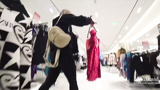 Naughty girl nearly gets caught while sucking cock in fitting room