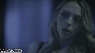 Hot brunette and blonde in a dark threesome scene, showcasing intense passion